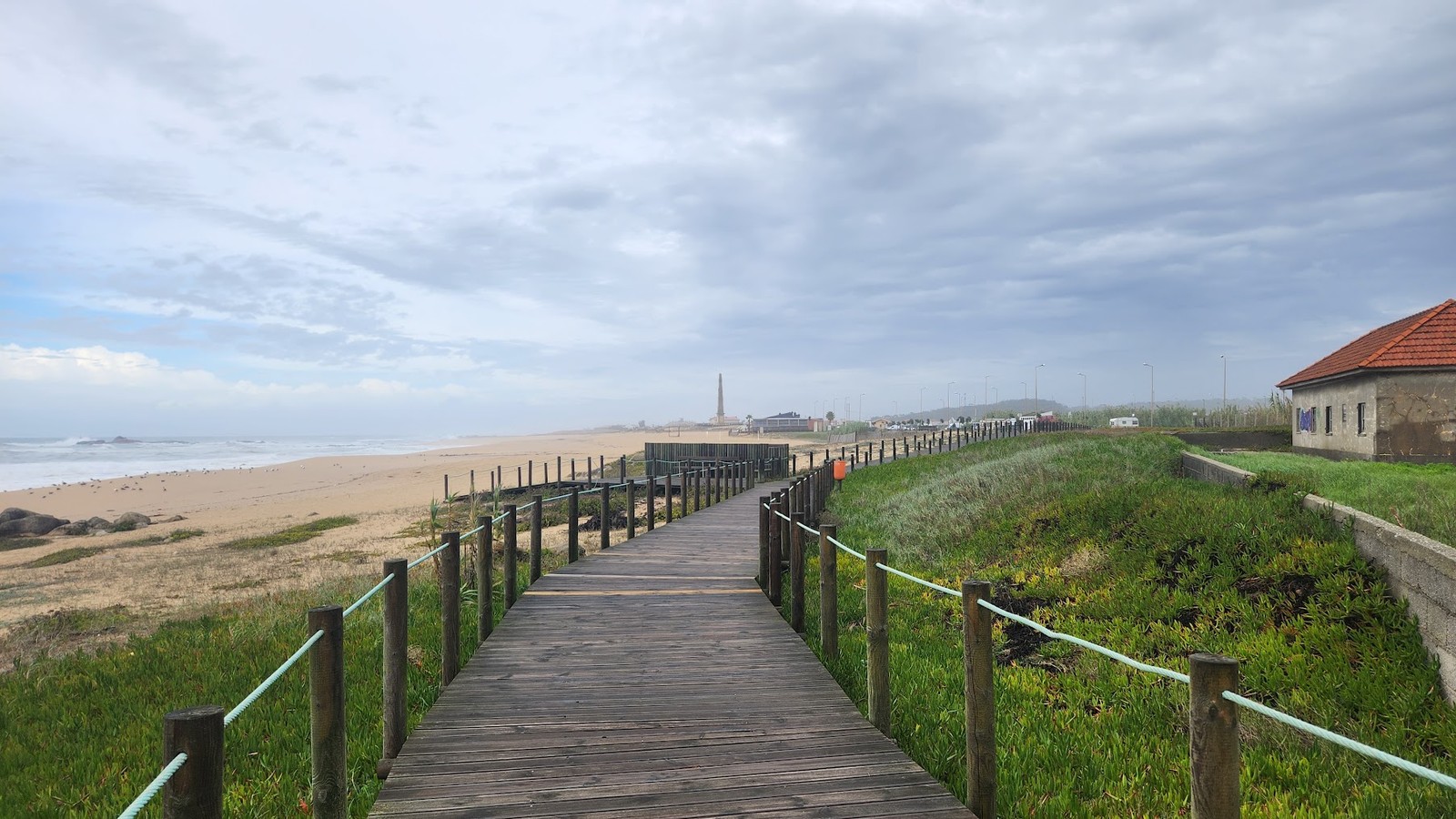 Wooden boardwalk running along the Atlantic coast on the Portuguese Camino